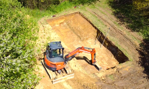 Digging the hole for an ourdoor pool installation
