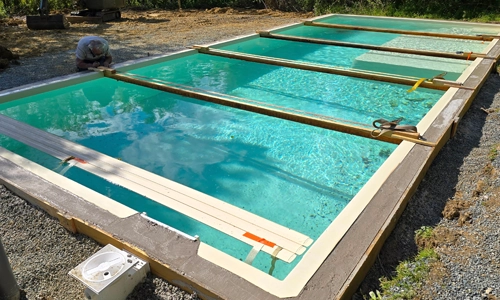 Concrete being placed for an ourdoor pool installation